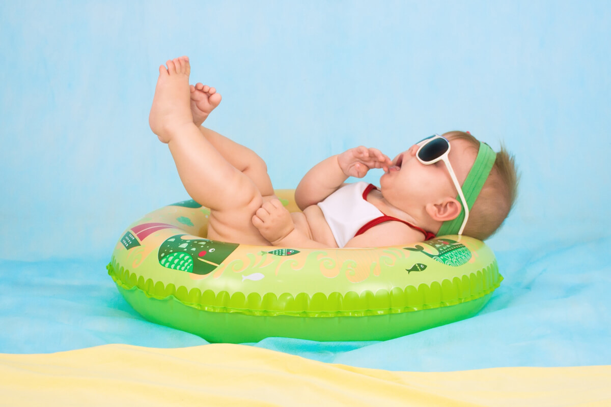 Happy baby with colorful toys